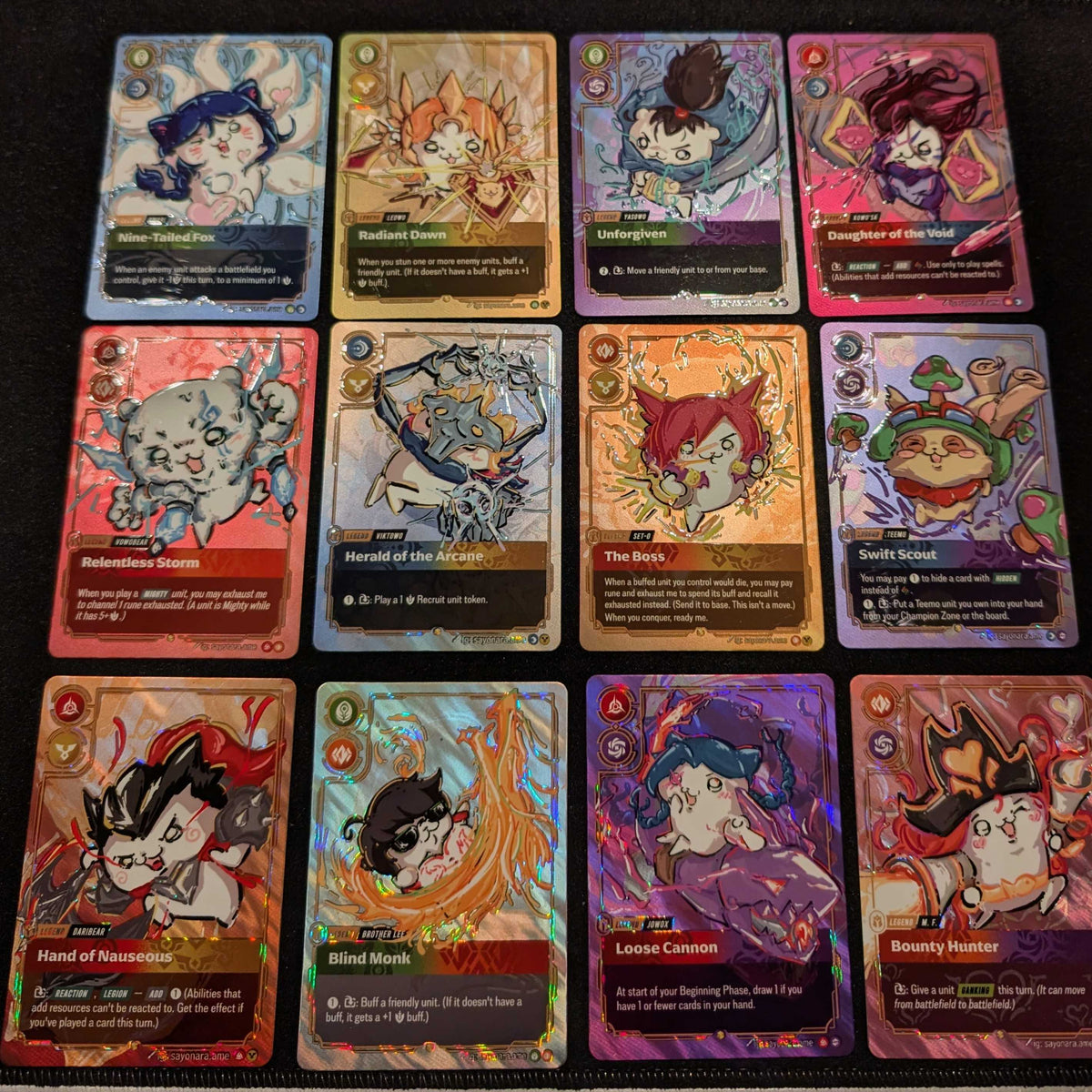 Suggestion


A 3x4 grid of twelve illustrated trading cards featuring cartoon animal characters, photographed on a dark textured surface. The cards have colorful fantasy-style artwork and visible text boxes, with no people or real environment beyond the tabletop background.